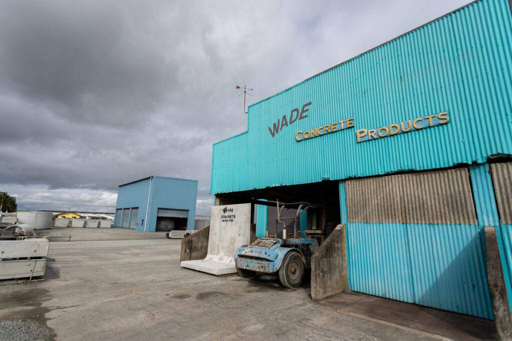 Wade Concrete Products, Dargaville, 22 Edward St, a bright blue warehouse